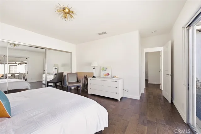 a bedroom with furniture and window