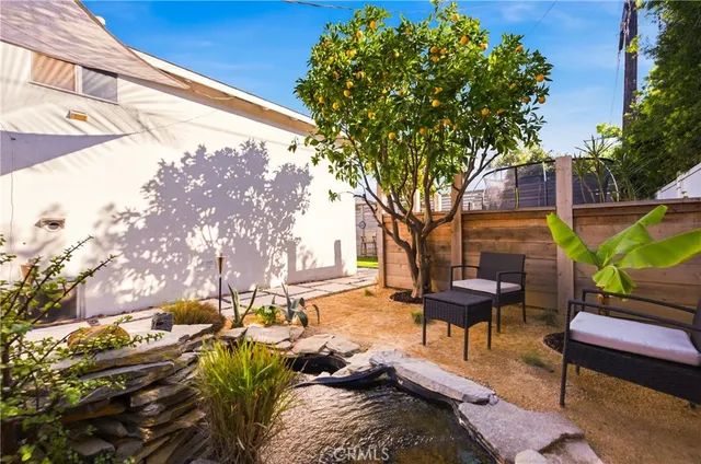 a view of a two chairs in a patio