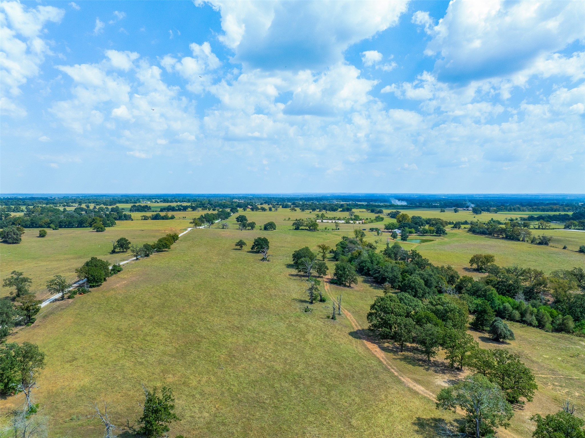 2 Rolke Ranch Road Franklin, TX 77856 - Photo 2 of 11 a view of a lake with a yard