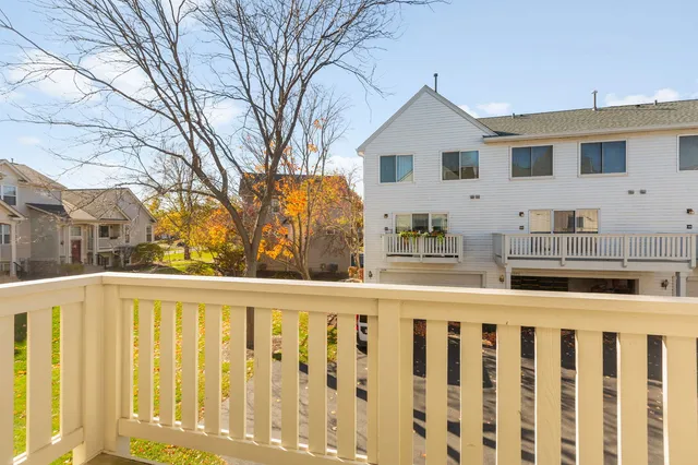 a front view of a house with wooden fence