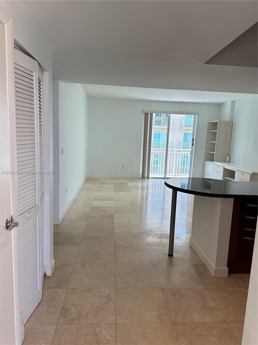 7275 Southwest 90th Street, Unit C408 Miami, FL 33156 - Photo 3 of 4 a view of livingroom with furniture and window