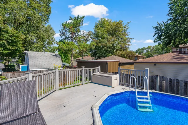 a balcony with table and chairs