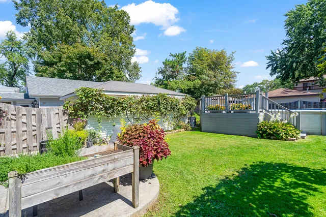a view of an house with backyard space and garden