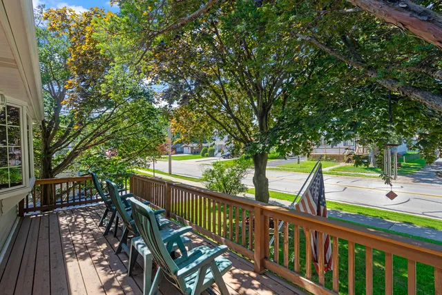 a view of a balcony with trees