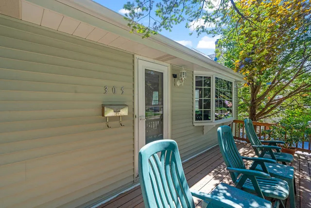 a balcony with table and chairs