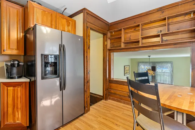 a kitchen with stainless steel appliances granite countertop a refrigerator and a sink