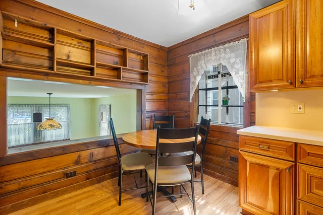 a dining room with furniture and window