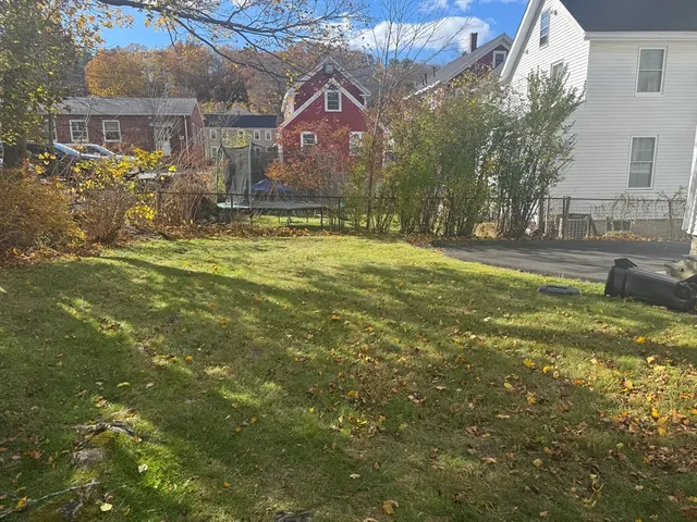 a kitchen with granite countertop cabinets stainless steel appliances a sink and a counter top