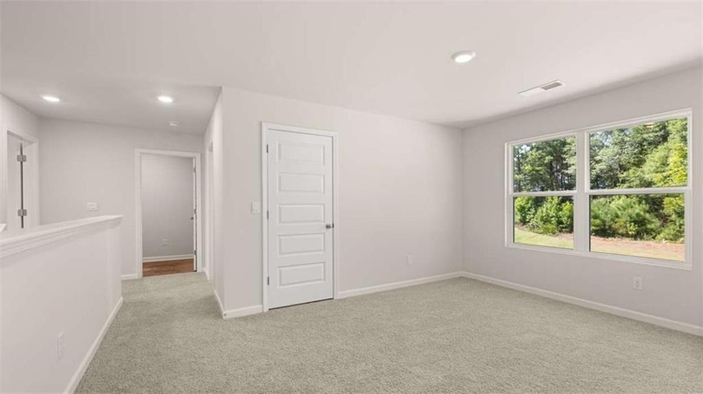 438 Abbott Road Statham, GA 30666 - Photo 29 of 56 an empty room with windows and closet