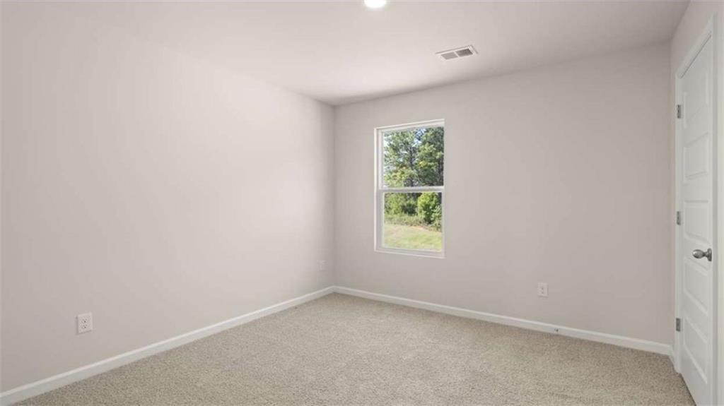 438 Abbott Road Statham, GA 30666 - Photo 34 of 56 an empty room with a window