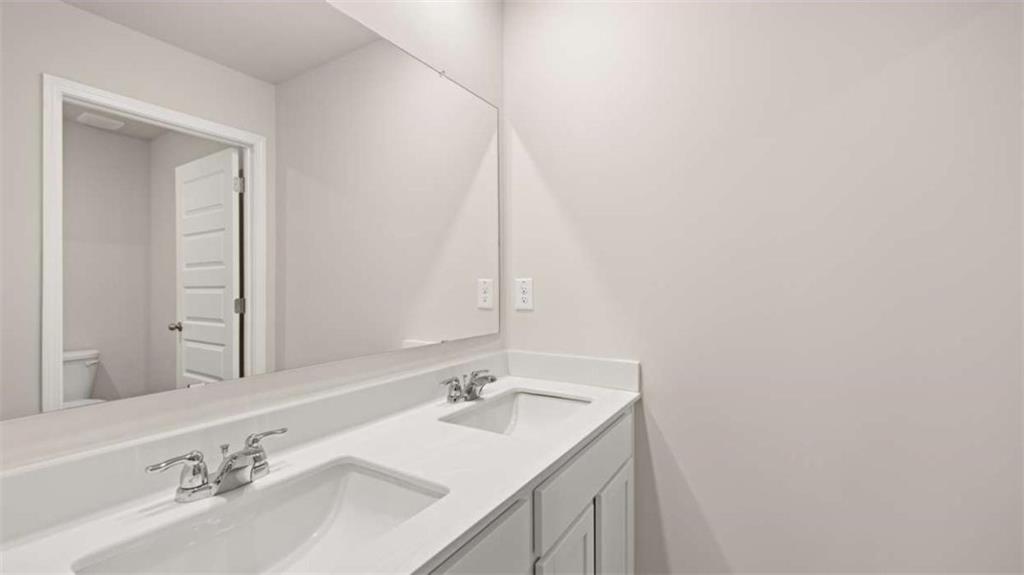 438 Abbott Road Statham, GA 30666 - Photo 37 of 56 a bathroom with a sink and a mirror