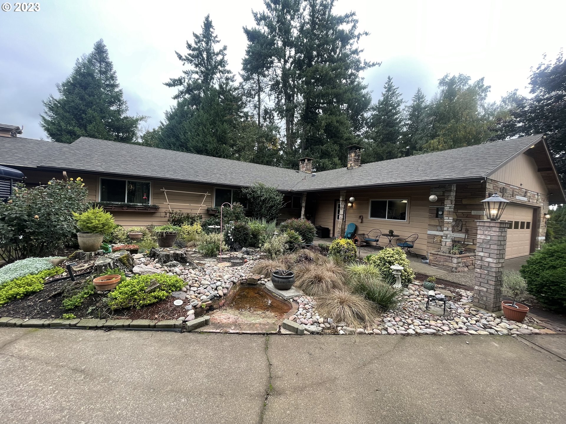 8181 Labish Center Road Northeast Silverton, OR 97381 - Photo 1 of 43 a front view of house with yard and outdoor seating