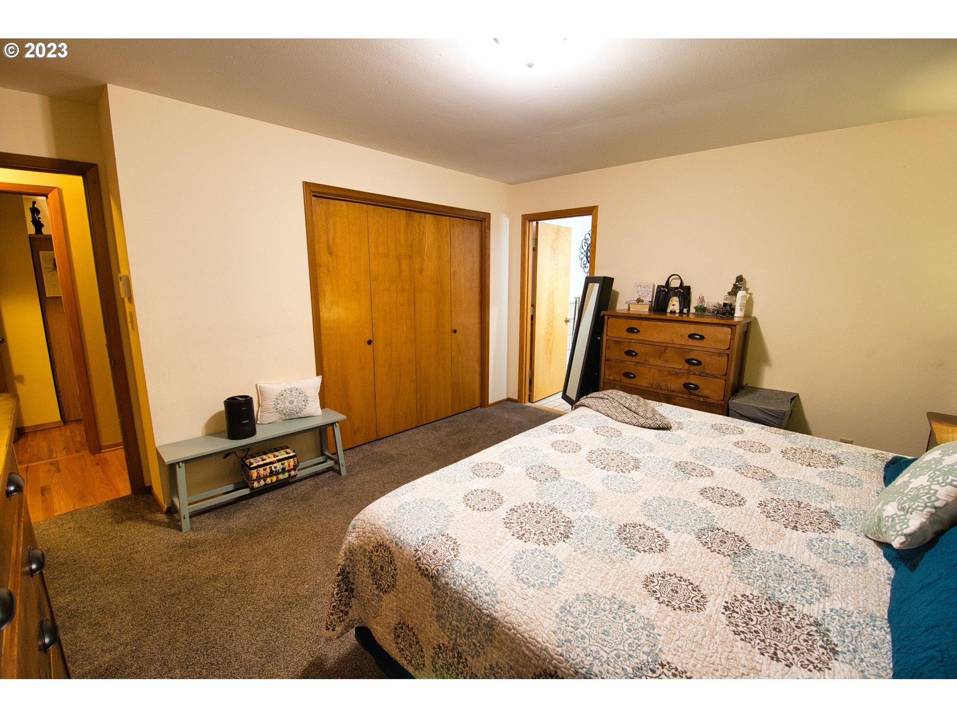 8181 Labish Center Road Northeast Silverton, OR 97381 - Photo 29 of 43 a bedroom with a bed and wooden floor