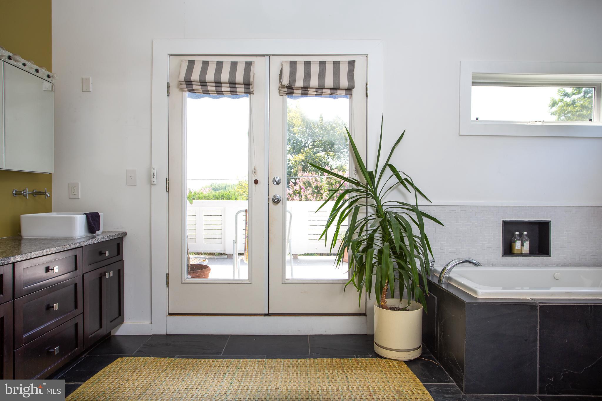 4523 Q Lane Northwest Washington, DC 20007 - Photo 34 of 55 Private patio with electric canopy off Master Bath