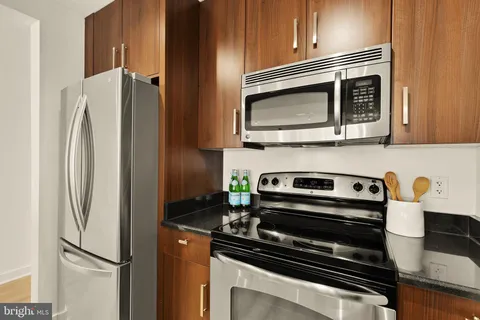 a kitchen with appliances and cabinets
