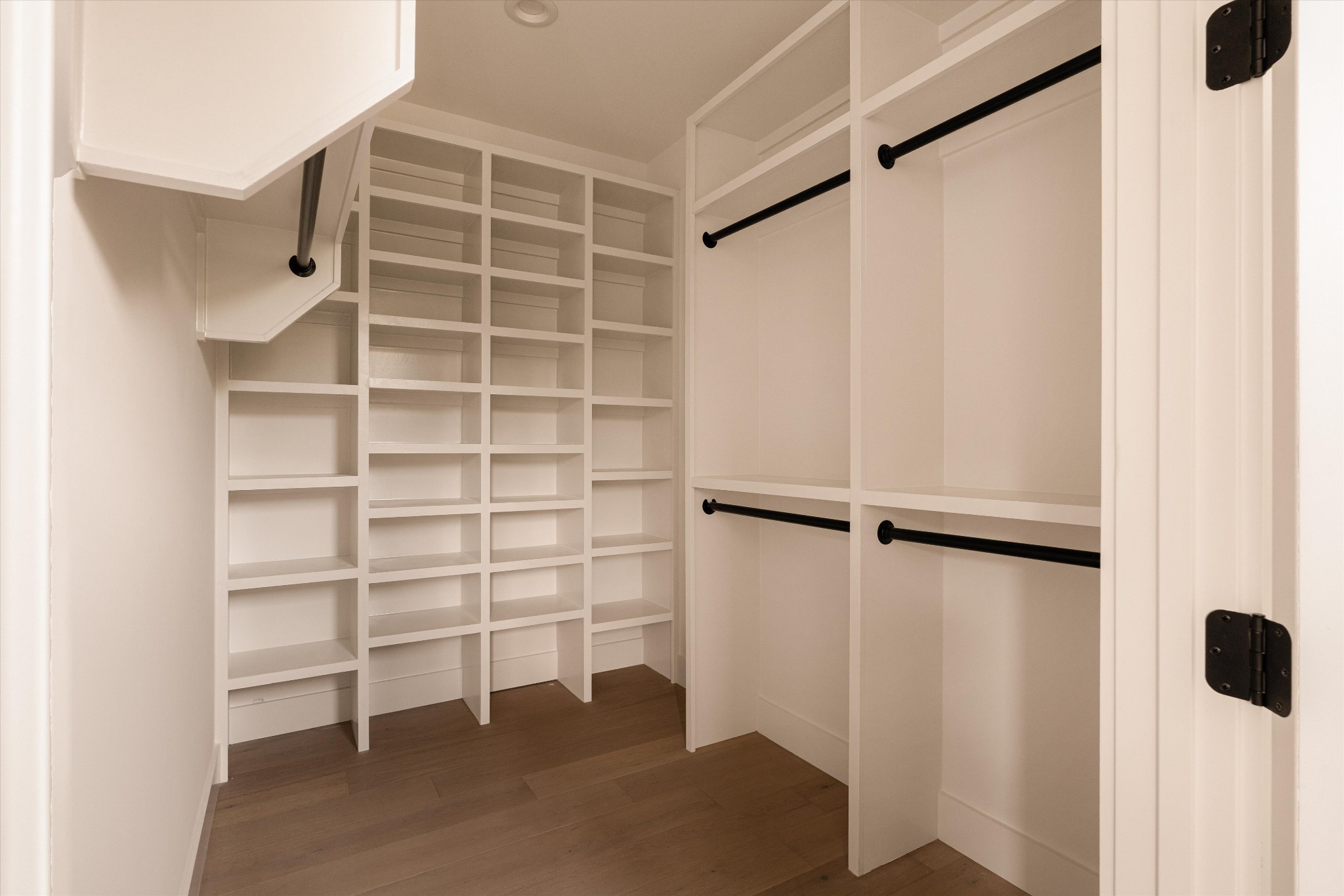 6801 Flat Creek Road College Grove, TN 37046 - Photo 51 of 66 a view of walk in closet with empty racks