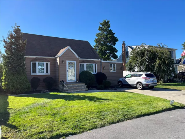 a view of a house with a yard porch and sitting area