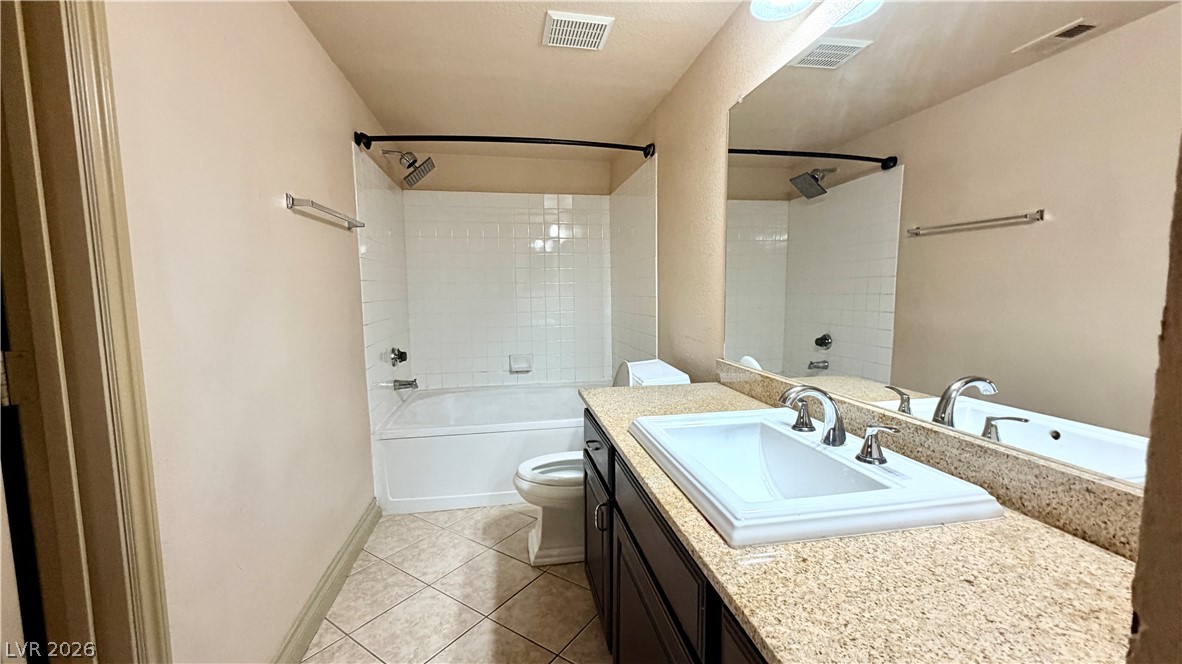 8101 West Flamingo Road, Unit 1082 Las Vegas, NV 89147 - Photo 22 of 23 A well-appointed bathroom with a spacious bathtub and granite vanity awaits.