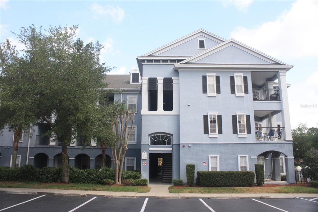 3621 Conroy Road, Unit 739 Orlando, FL 32839 - Photo 20 of 20 a front view of a residential apartment building with a yard