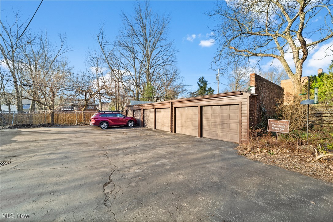 2472 Overlook Road, Unit 3 Cleveland, OH 44106 - Photo 10 of 11 View of parking featuring fence