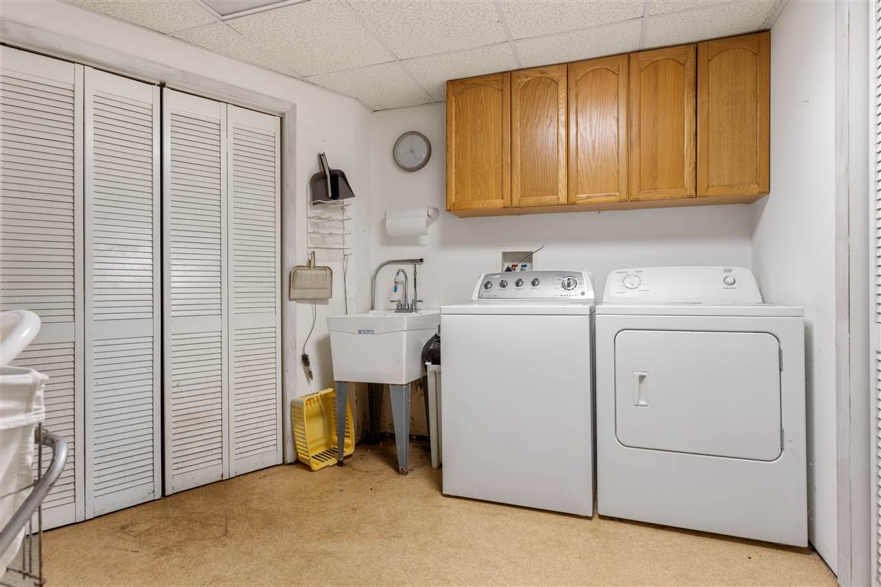 10417 Fruit Farm Road Garden Prairie, IL 61038 - Photo 20 of 25 a view of storage and utility room with washer and dryer