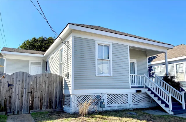 a view of a house with wooden deck