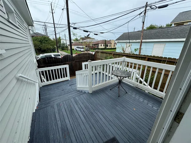 a view of a balcony with wooden floor