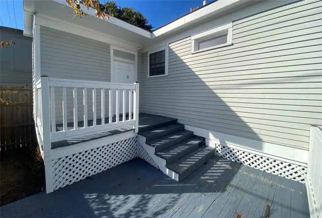 a view of a wooden chair on the deck