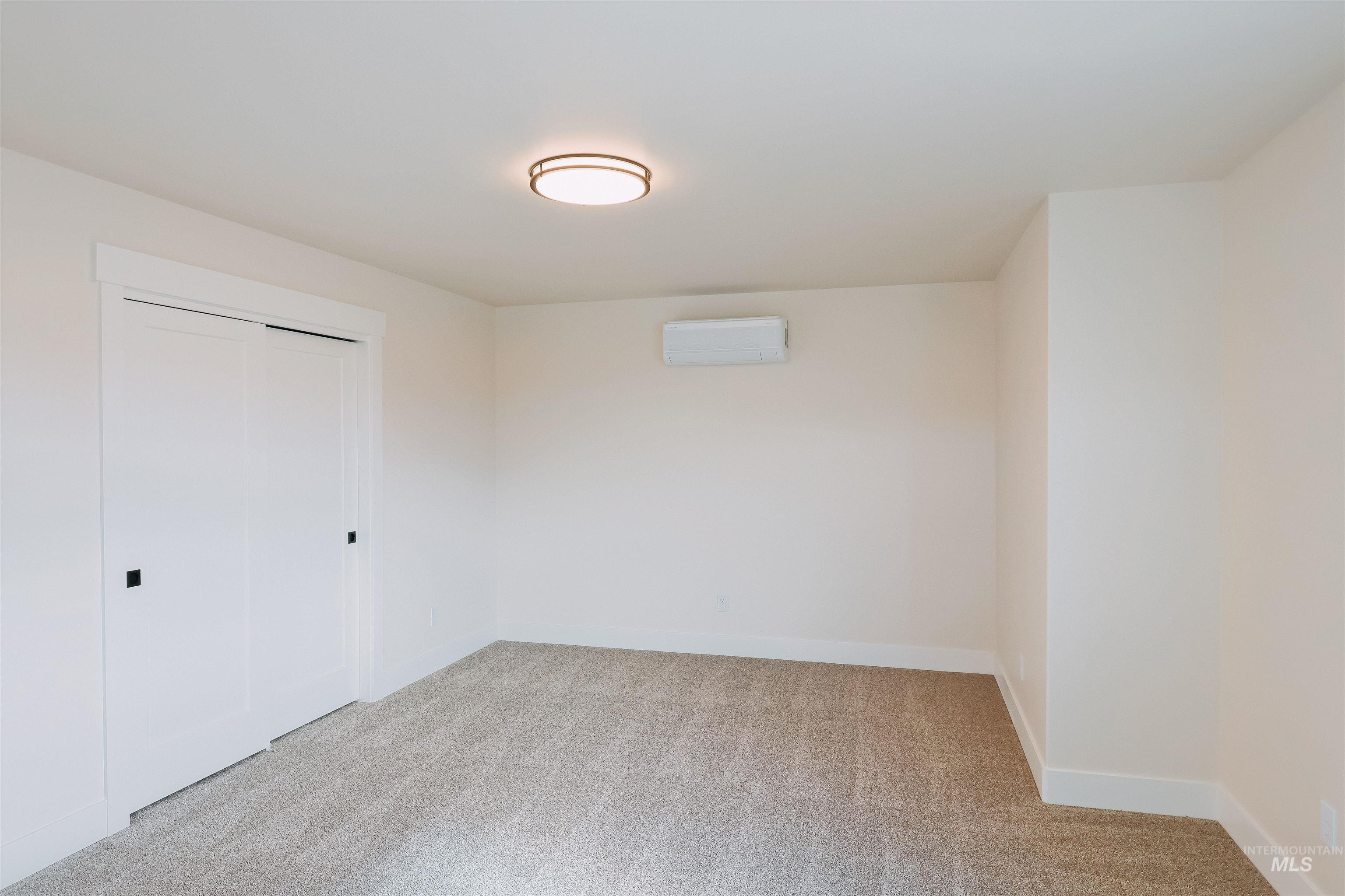 10 North Crk Way Cascade, ID 83611 - Photo 8 of 25 Unfurnished bedroom featuring light carpet and a closet