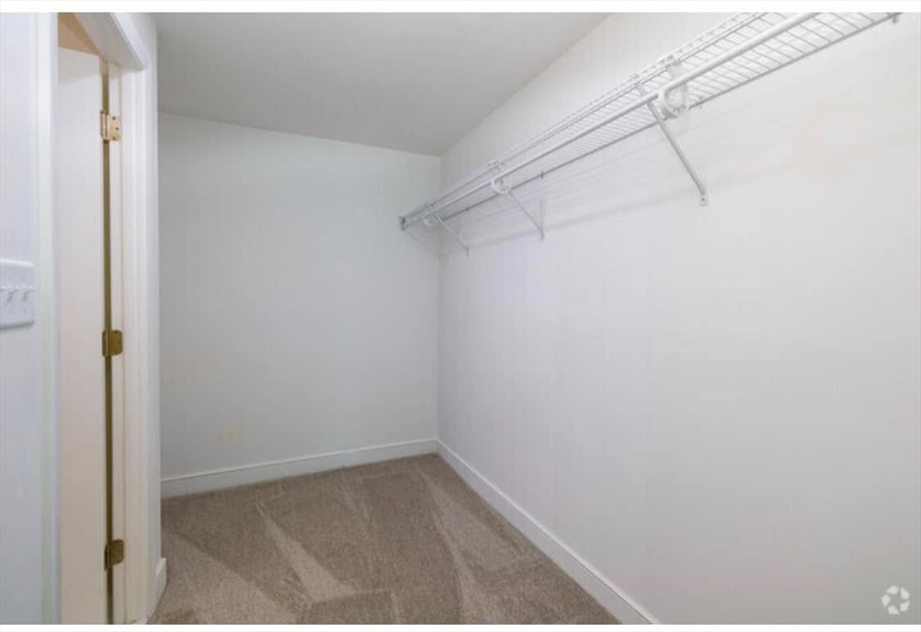 7 Stonehill Drive, Unit 1B Stoneham, MA 02180 - Photo 11 of 21 a view of small space with racks on the wall