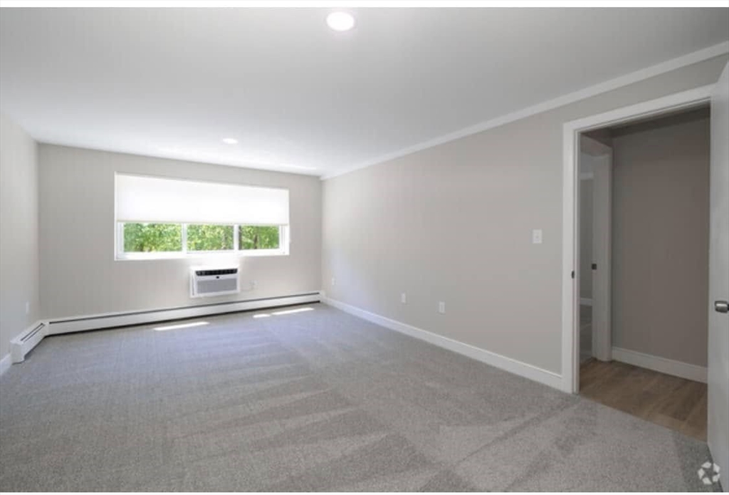 7 Stonehill Drive, Unit 1B Stoneham, MA 02180 - Photo 9 of 21 an empty room with windows