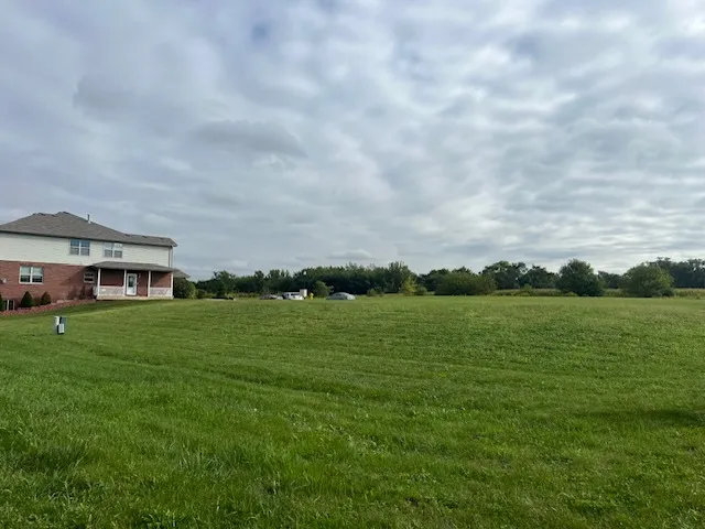 a view of a house with a big yard