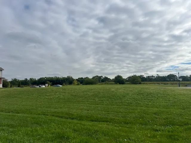 a view of a golf course with a lake