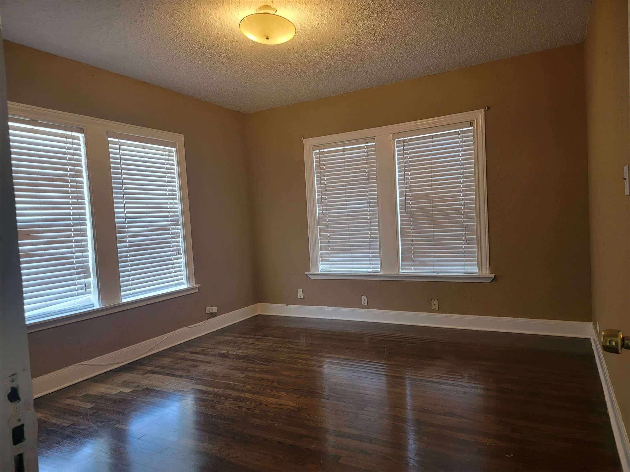 2601 Wheeler Avenue Houston, TX 77004 - Photo 19 of 47 a view of an empty room with wooden floor and a window