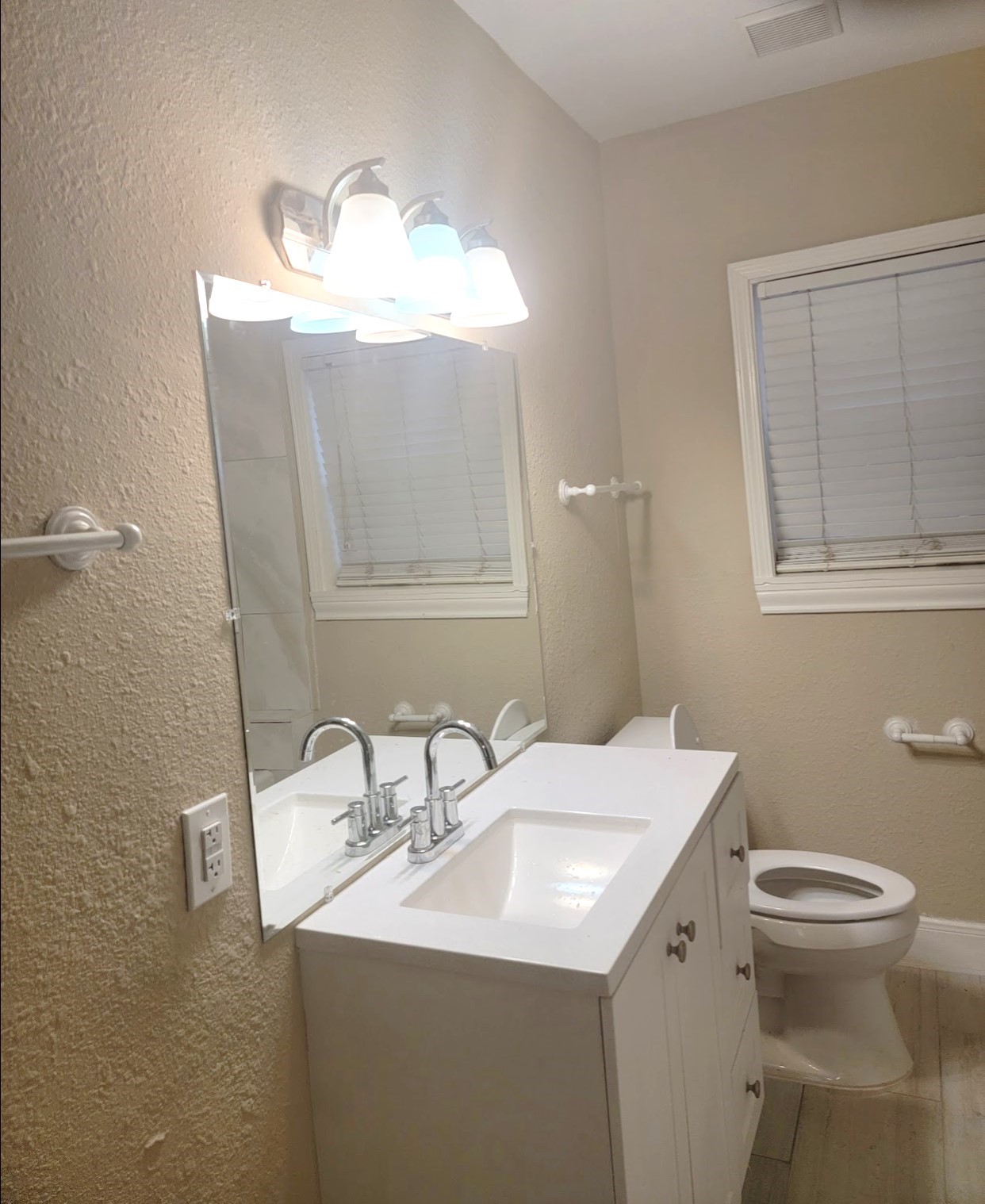 2601 Wheeler Avenue Houston, TX 77004 - Photo 6 of 47 a bathroom with a toilet sink and mirror