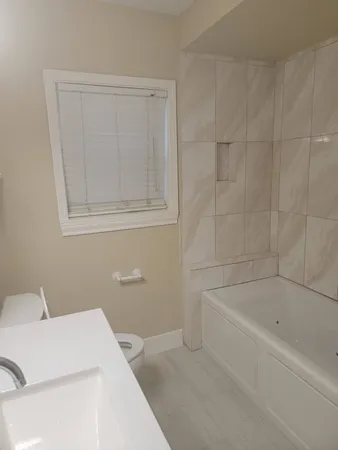 a bathroom with a sink vanity and a mirror
