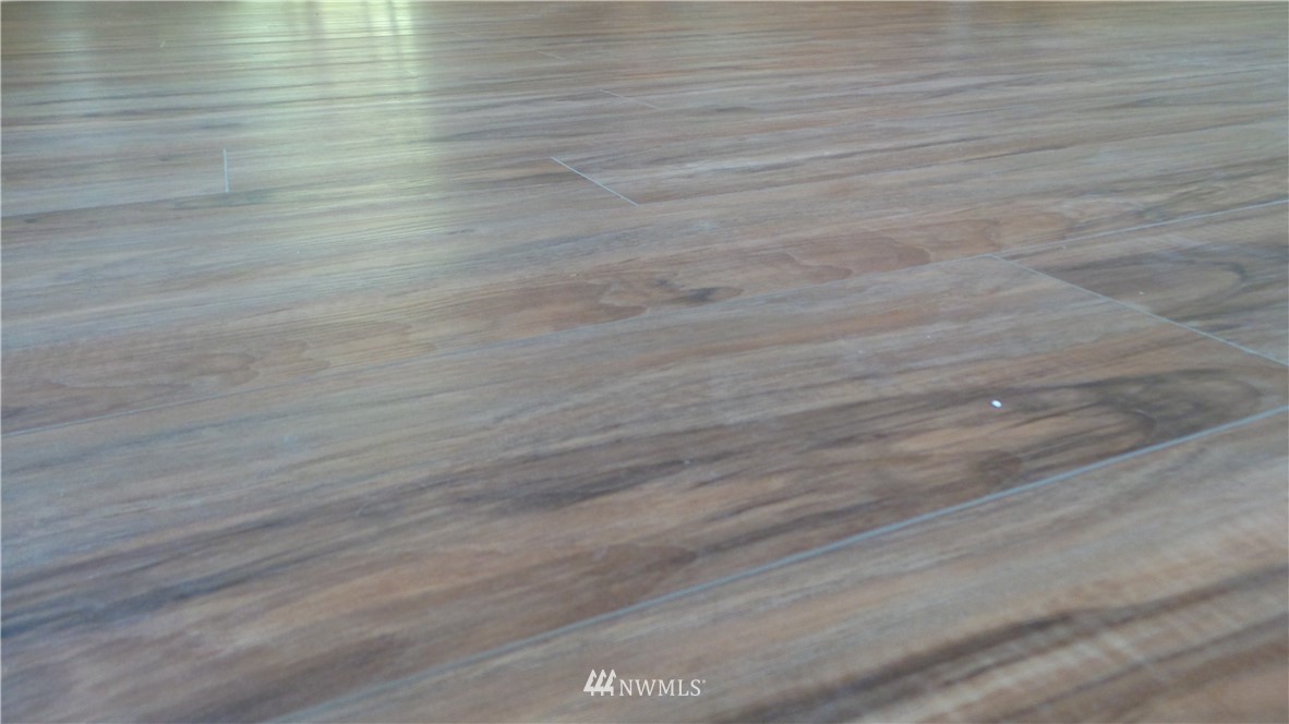 7907 175th Avenue Southwest Rochester, WA 98579 - Photo 12 of 39 a view of a room with wooden floor
