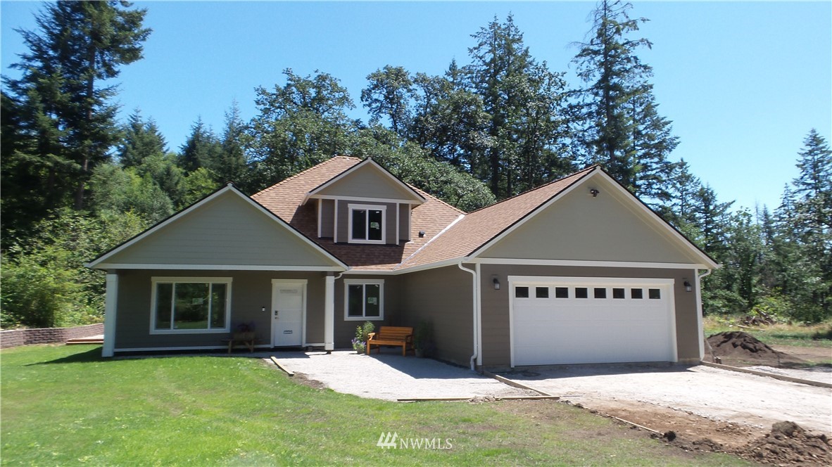7907 175th Avenue Southwest Rochester, WA 98579 - Photo 3 of 39 front view of a house with a yard