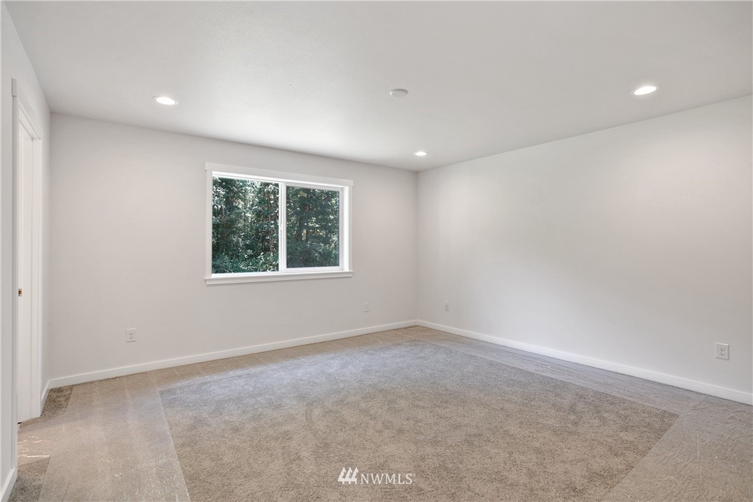 7907 175th Avenue Southwest Rochester, WA 98579 - Photo 22 of 39 an empty room with windows