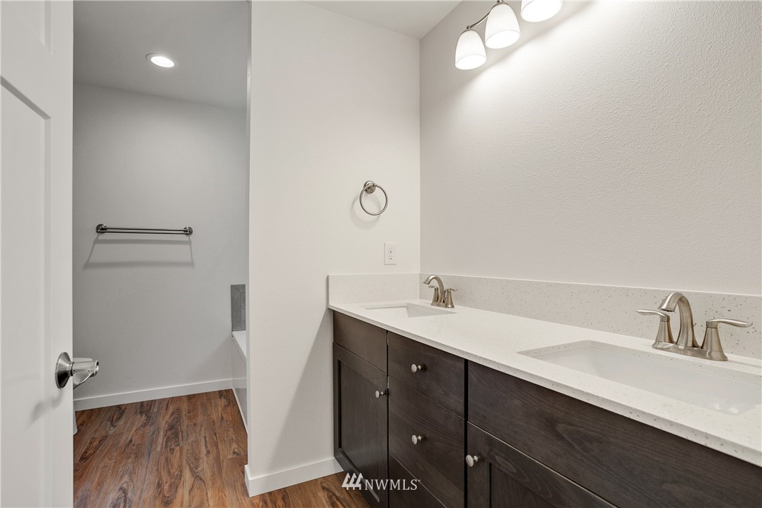 7907 175th Avenue Southwest Rochester, WA 98579 - Photo 24 of 39 a bathroom with a double vanity sink and mirror