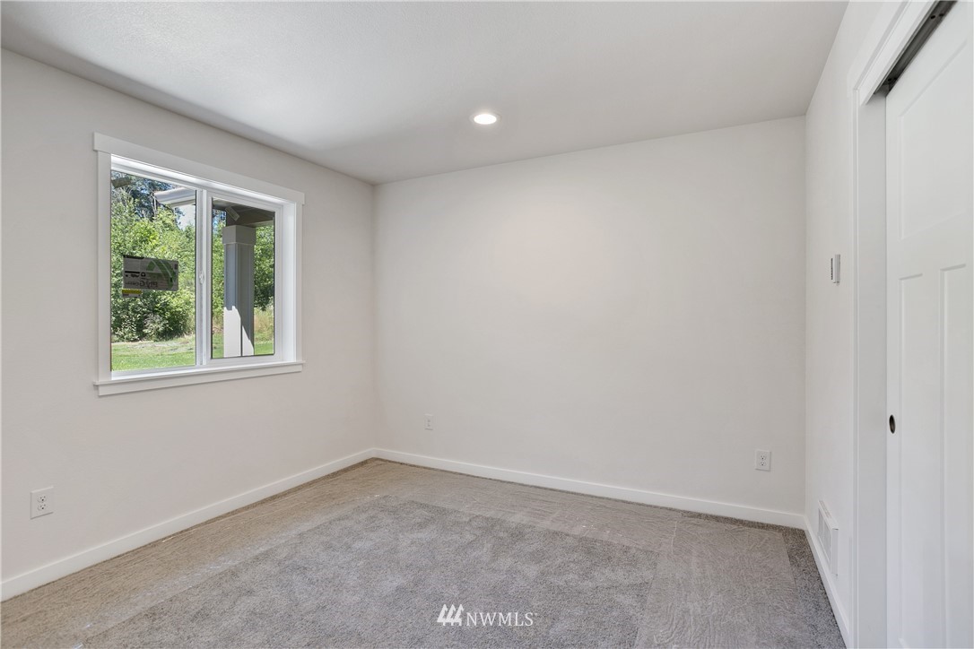 7907 175th Avenue Southwest Rochester, WA 98579 - Photo 26 of 39 an empty room with a window