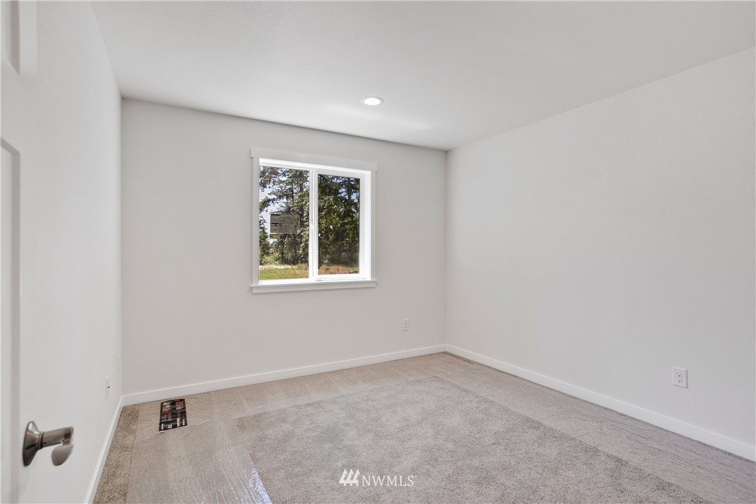 7907 175th Avenue Southwest Rochester, WA 98579 - Photo 29 of 39 an empty room with a window