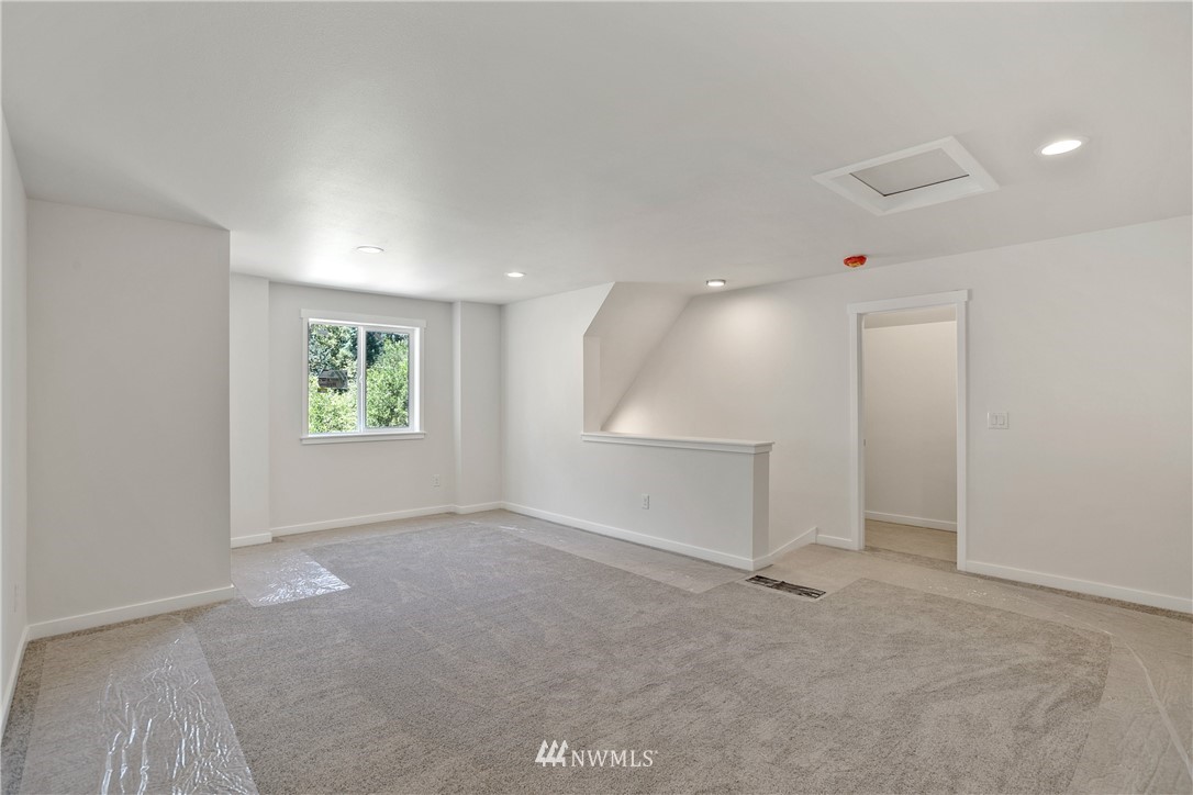 7907 175th Avenue Southwest Rochester, WA 98579 - Photo 31 of 39 an empty room with a empty space and window