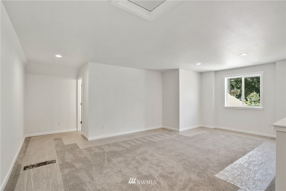 7907 175th Avenue Southwest Rochester, WA 98579 - Photo 32 of 39 an empty room with windows