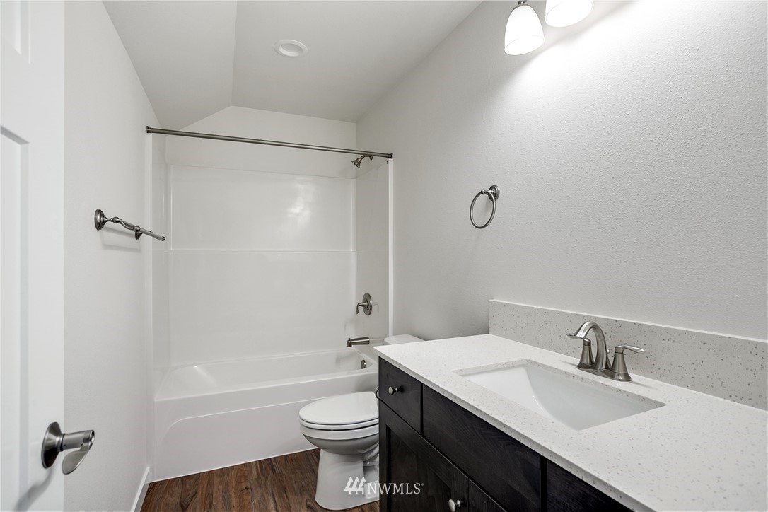 7907 175th Avenue Southwest Rochester, WA 98579 - Photo 33 of 39 a bathroom with a sink toilet vanity and shower