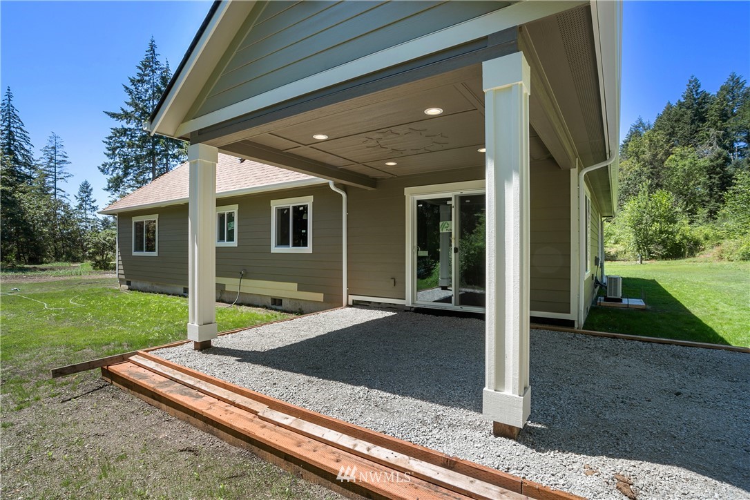 7907 175th Avenue Southwest Rochester, WA 98579 - Photo 34 of 39 a view of a house with backyard and porch