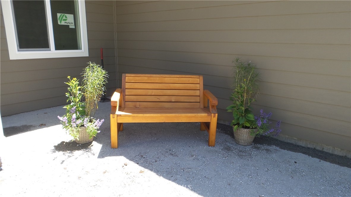 7907 175th Avenue Southwest Rochester, WA 98579 - Photo 7 of 39 a backyard of a house with a fountain