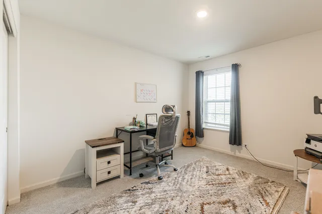 a workspace with furniture and window