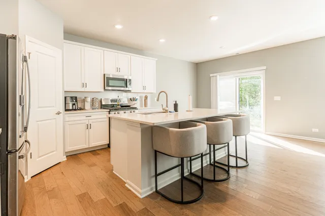 a kitchen with a sink cabinets and window