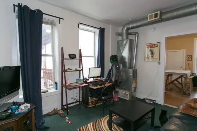 a room with furniture and a flat screen tv